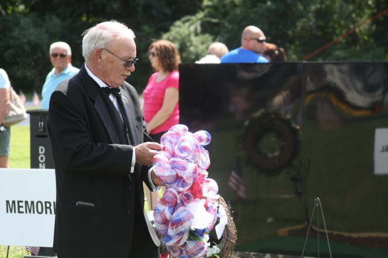 Lee Bowman of the Orleans-Eastham Lodge of Elks participates in Sunday's Moving Wall ceremony. BY MATTHEW BERNAT
